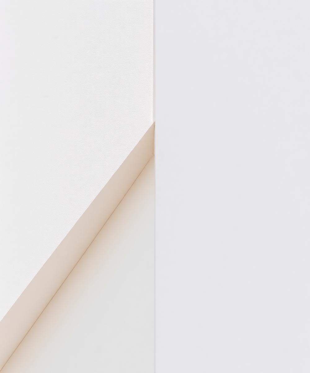 Crisp stucco corner with a sharp shadow line